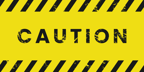 Black and yellow caution tape sign. Warning background with grunge texture.