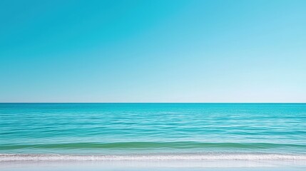 Fototapeta premium Calm turquoise water meets a clear blue sky horizon