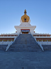 Magnificent Stupa with Golden Spire and Colorful Flags