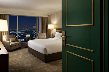 Luxurious Hotel Room with City Views at Night