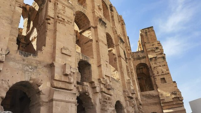 Exterior of Ancient Roman Amphitheatre Under a Blue Sky in El Jem, Tunisia