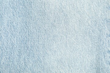 Texture of light blue jeans as background, top view