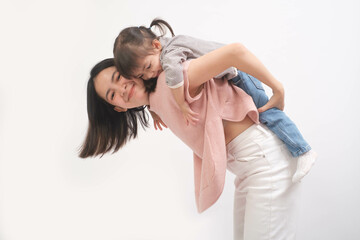 Joyful mother playing with her child in a bright room, embodying happiness and family bonding in a...