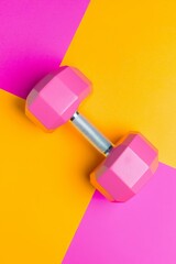 Dynamic weightlifting action home gym fitness equipment bright colors overhead view motivation and wellness