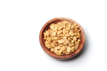 salted broad beans close up in a wooden bowl. top view, good for recipe or commercial, isolated on white background