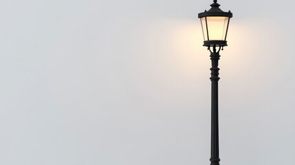 A street lamp with a white background, simple and clean with a pure black base and an illuminated top.