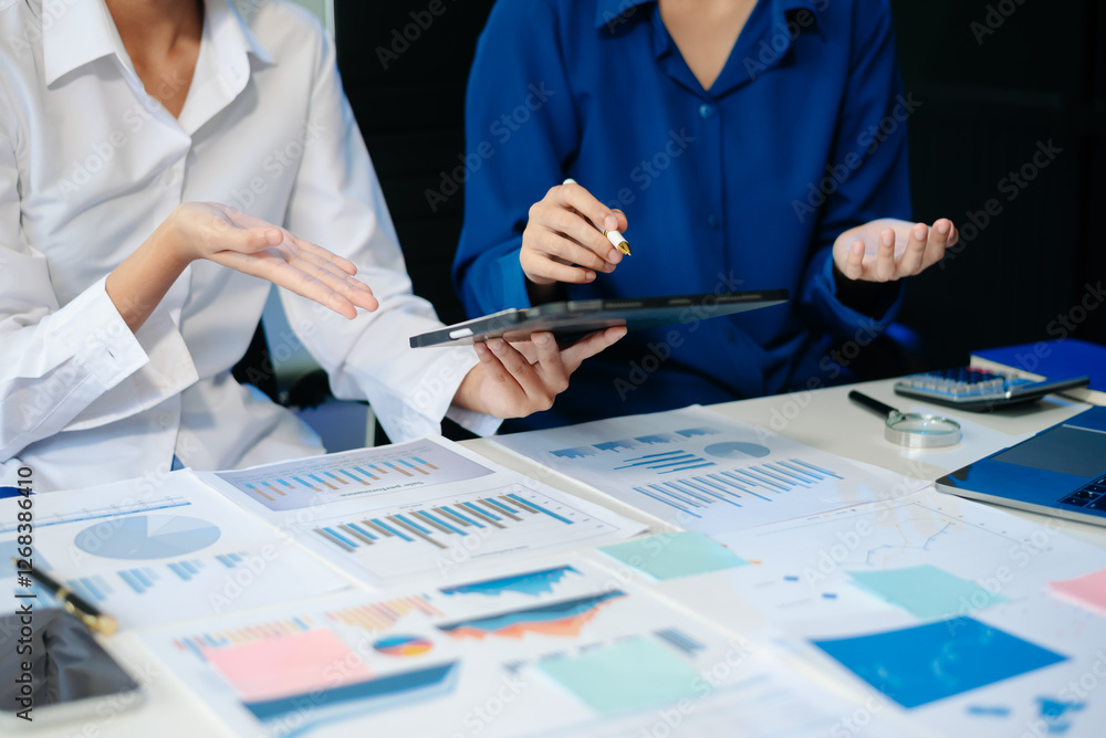 Poster business documents on office table with smart phone and calculator digital tablet and graph business