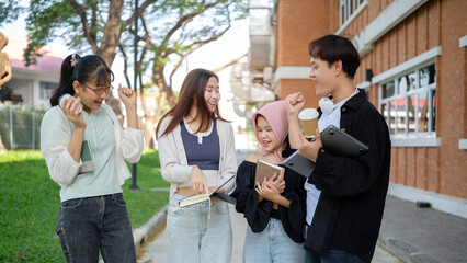 Happy young friends enjoying a lively conversation outdoors, showcasing academic camaraderie.