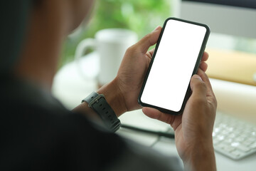 Close-up of a person holding a smartphone with a blank screen, ideal for showcasing mobile app designs, user interfaces, or digital services.