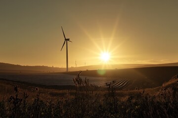 Obraz premium Sunrise over wind turbine and solar farm