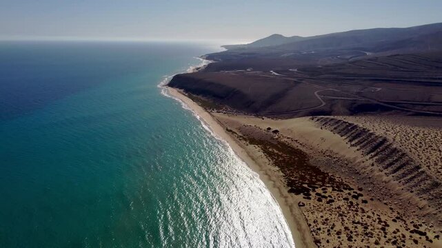 Flying over the Playa de Los Canarios, a beach in Fuerteventura, Spain