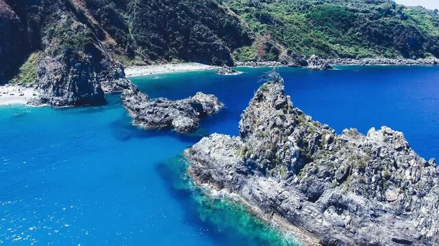Ulivarella Beach and Ulivo Rock aerial view in slow motion, Calabria, Italy
