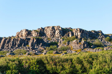 Rocky tundra landscape on the Rybachy Peninsula, Murmansk region, Russia. Sunny summer day