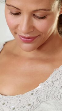 Pregnant woman with bowl of strawberries