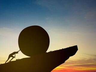 Effort and perseverance, businessman pushes a boulder up a high mountain