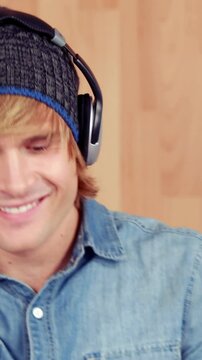 Hipster listening to music and smiling