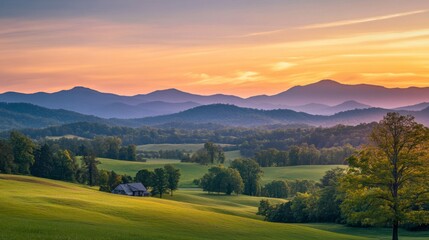 Obraz premium A serene sunset over rolling hills, with golden light cascading onto lush green meadows and distant mountain ranges