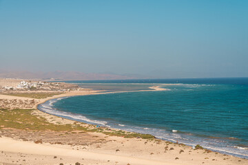 Aerial view of Playa de Sotavento de Jandia in Fuerteventura, showcasing the long sandy beach, turquoise waters, and coastline