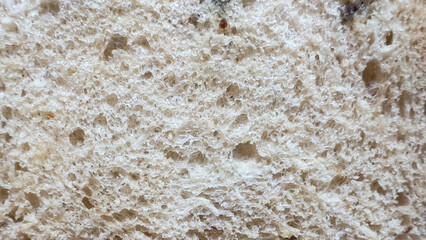 Bread surface, soft and perforated texture, bread slice background, abstract background.