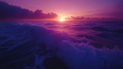 Fototapeta premium Stunning sunset over the ocean with waves reflecting vibrant purple hues.
