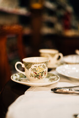 vintage cups and saucers on the table