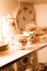 vintage dishes on shelves in a store