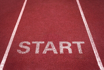 Red running track with white lanes in a stadium for athletics competitions and sprint races