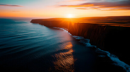 Fototapeta premium Vibrant Sunset Over Ocean Cliffs