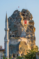 Rock castle of Ortahisar with minaret in Cappadocia, Turkey
