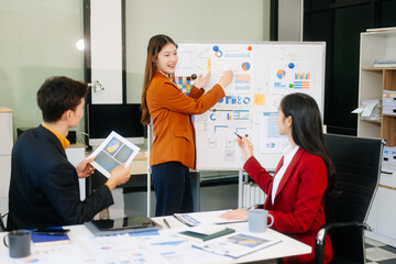 Office colleagues have a casual discussion. During a meeting in a conference room, a group of business teem