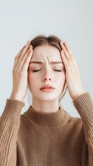 Distressed woman with closed eyes against minimalist white background