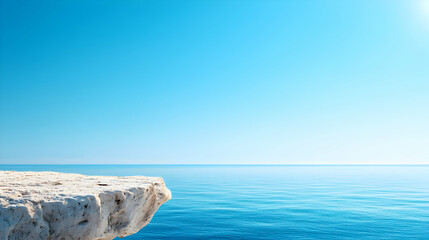 White Cliff Overlooking Blue Ocean Under Bright Sky