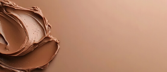 Creamy mocha mousse smear on brown background