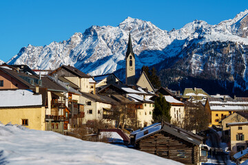 The traditional mountain village of Guarda in Engadin (Graubünden, Switzerland) in winter with a...