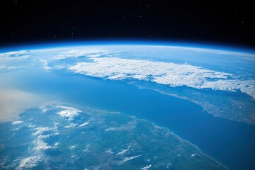 Fototapeta premium View of the Earth from space highlighting coastlines, clouds, and blue ocean during daylight hours. Generative AI