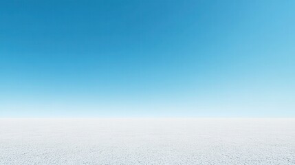 Obraz premium Serene landscape with clear blue sky meeting a vast expanse of white ground, a peaceful minimalism