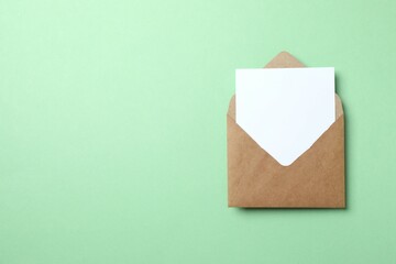 Paper envelope with white card on color background
