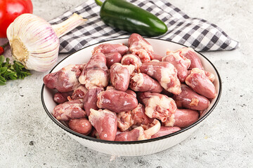 Fresh raw chicken hearts in the bowl