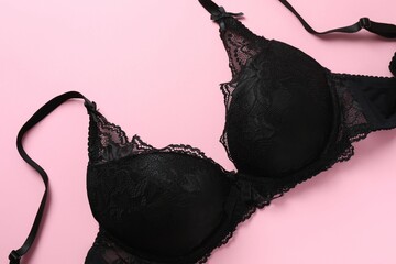 Flat lay with women romantic underwear on pink background, top view