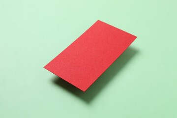 Red paper card on color background