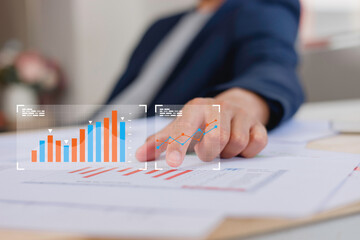 Businessman touch investment growth graph chart and analysing growth achievement diagram data...