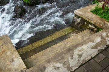 Close-Up of Small Concrete Plaster Stairs by Mountain River.
