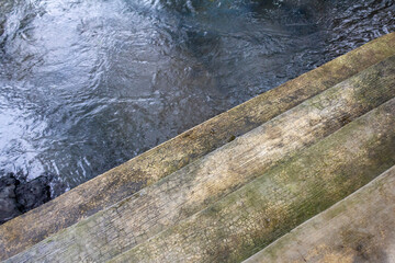 Close-Up of Small Concrete Plaster Stairs by Mountain River.