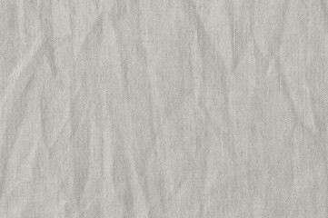 Natural bright linen cotton blend chinos trousers background, large detailed horizontal flax fibers macro closeup, rustic crumpled vintage textured burlap grey white khaki canvas fabric swatch pattern