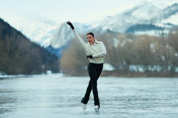 Figure skater girl on winter lake.