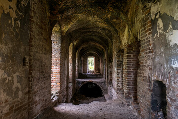 Fototapeta premium The ruins of the Roman Catholic Carmelite monastery and the Church of the Immaculate Conception of the Virgin Mary in the village of Kysylyn, Volyn region, Ukraine, July 10, 2023