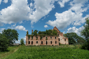 Fototapeta premium The ruins of the Roman Catholic Carmelite monastery and the Church of the Immaculate Conception of the Virgin Mary in the village of Kysylyn, Volyn region, Ukraine, July 10, 2023