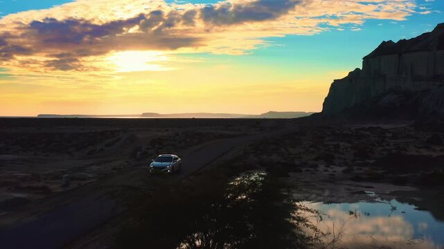 Aerial desert with unique rock formations and a sea in Hingol Balochistan National Park at sunset