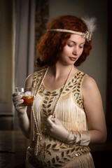 1920s woman with glass of whisky