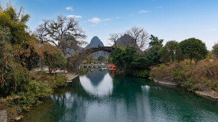 Bamboo rafts and arch bridges on the Yulong River in Yangshuo, Guilin, Guangxi, China